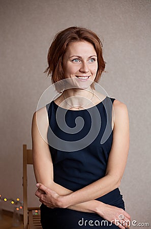 Beautiful lady in elegant black evening cocktail dress Stock Photo