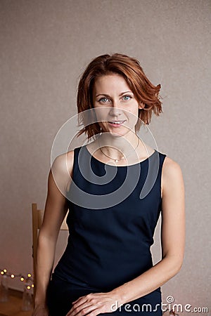 Beautiful lady in elegant black evening cocktail dress Stock Photo