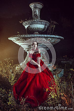 Beautiful lady near the fountain Stock Photo