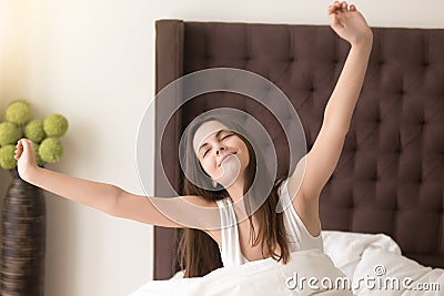 Beautiful lady satisfied good sleep in hotel room Stock Photo