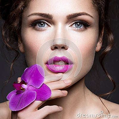 Beautiful lady with a wreath of flowers Stock Photo