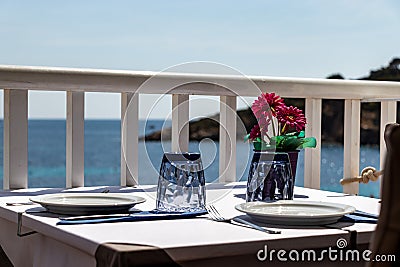 Beautiful laid table in a restaurant overlooking the mediterranean sea in sant elm, mallorca, spain Stock Photo