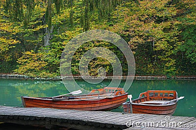 Lake in forest with boat in national park Plitvice, Croatia Stock Photo