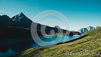 Beautiful lake in green mountains in Riale, Italy on a sunny day Stock Photo