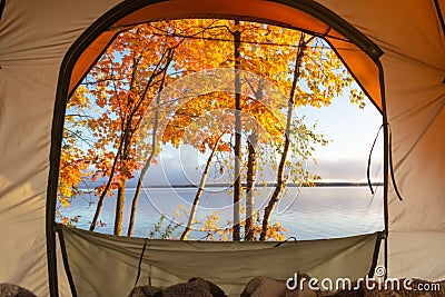 Beautiful lake view with fall leaves from a tent window Stock Photo