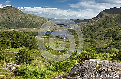 The beautiful Lakes of Killarney, nestling among the Kerry mountains on a sunny summer day. This scenic view of the valley was Stock Photo