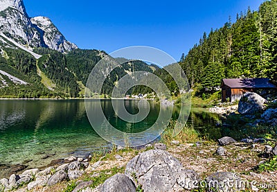 Beautiful landscape of alpine lake with crystal clear green water and mountains in background, Gosausee, Austria Stock Photo