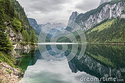 Beautiful landscape of alpine lake with crystal clear green water and mountains in background, Gosausee, Austria. Romantic place. Stock Photo