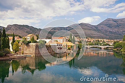 Beautiful landscape with ancient city on river bank. Bosnia and Herzegovina, view of Trebisnjica river and Old Town of Trebinje Stock Photo