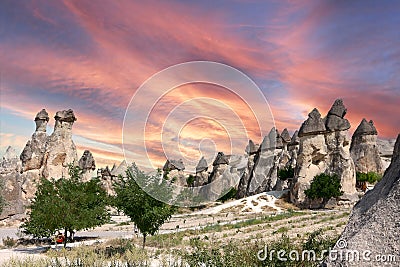 Beautiful landscape Cappadocia stone and old cave house with horse tour in Goreme national park Turkey Sunset Stock Photo