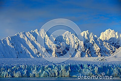 Beautiful landscape. Cold sea water. Land of ice. Travelling in Arctic Norway. White snowy mountain, blue glacier Svalbard, Norwa Stock Photo