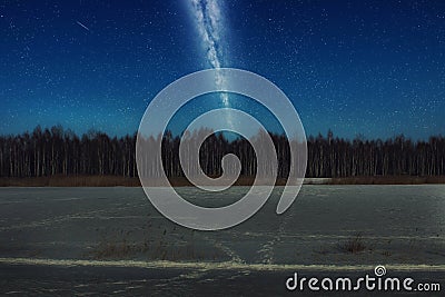 Beautiful landscape of forest birch trees at night against the blue starry sky and milky way. Night landscape background Stock Photo