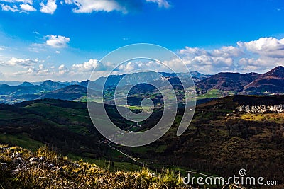 Beautiful landscape full of color, lights and shadows, between mountains and hills Stock Photo