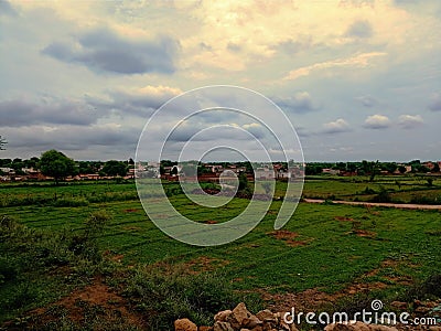 Beautiful landscape image of green land with clouds Stock Photo