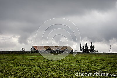 Beautiful landscape of mountains and forest with village building or old abandoned ruined brick house. Foggy forest and old buildi Stock Photo