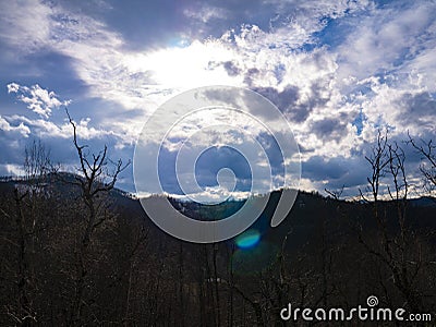 Beautiful landscape in the mountains at sunset. View of colorful sky with amazing clouds Stock Photo