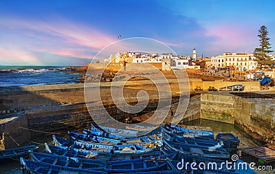 Fishing port and Essaouira town at the sunset time, Morocco Stock Photo