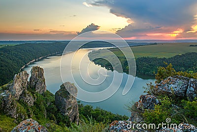 Beautiful landscape over the river and ancient mystical rocks on background of magnificent sky, Dniester Bay, nature in Ukraine Stock Photo