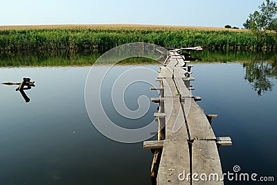 Beautiful landscape with a pond bridge over it. Stock Photo