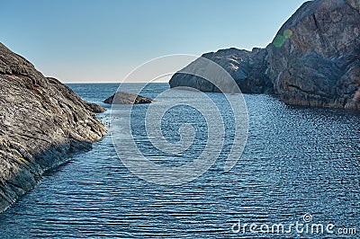 Beautiful landscape of rocky cliffs facing the sea in Flekkefjord, Norway Stock Photo