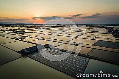 Beautiful landscape at sunset salt Farming. sea-salt production in the country, Stock Photo