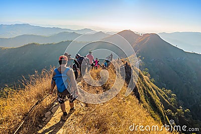 Beautiful landscape with trekkers walking on mountain ridge in sunset at Thong Pha Phum National Park Kanchanaburi of Thailand Editorial Stock Photo