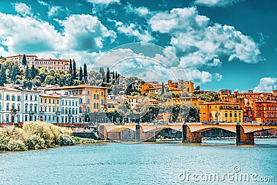 Beautiful landscape view bank of the Arno River of the Florence - Bridge to Thanksgiving Ponte alle Grazie. Italy Stock Photo