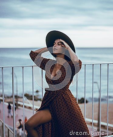 Beautiful Hispanic model wearing a summer dress Stock Photo