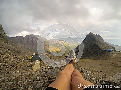 Beautiful legs against the background of mountain peaks Stock Photo