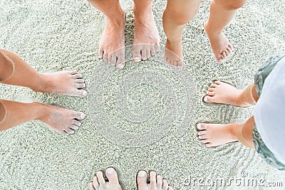 Beautiful legs on the sand by the sea Stock Photo