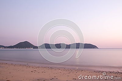 The evening sky when the sun set over the sea and mountains Stock Photo