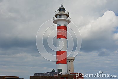 Beautiful lighthouse and fishing museum in the wonderful bay filled with volcanic stones in Bajo Ballena. El Cotillo La Oliva Editorial Stock Photo