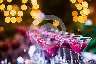 Beautiful line of different colored alcohol cocktails with smoke on a Christmas party, tequila, martini, vodka, and others on part Stock Photo