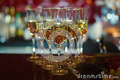 Beautiful line of different colored alcohol cocktails with smoke on a Christmas party, tequila, martini, vodka, and others on part Stock Photo