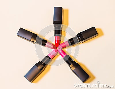 Beautiful lipsticks on beige background Stock Photo