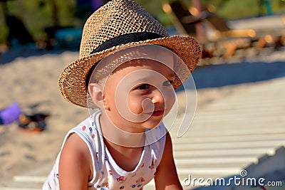 Beautiful little boy smiling on the beach Stock Photo