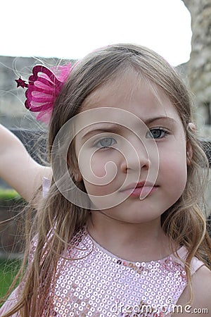 Beautiful little girl with big blue eyes portrait Stock Photo