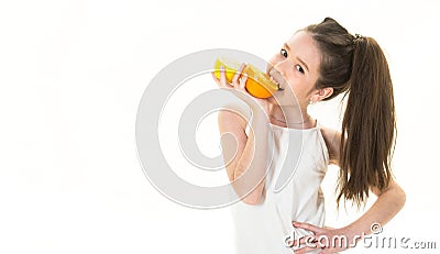 Beautiful little girl with oranges, lemons, grapefruits, vitamin. Baby girl holding a big juicy orange. Little girl Stock Photo