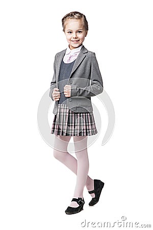 Beautiful little girl in school uniform isolated Stock Photo