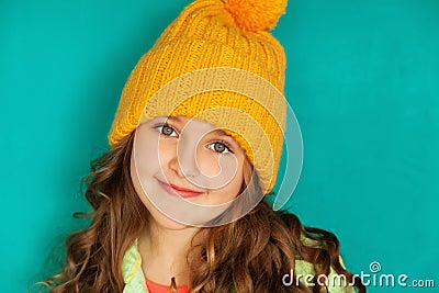 Beautiful little lady in yellow woolen cap Stock Photo