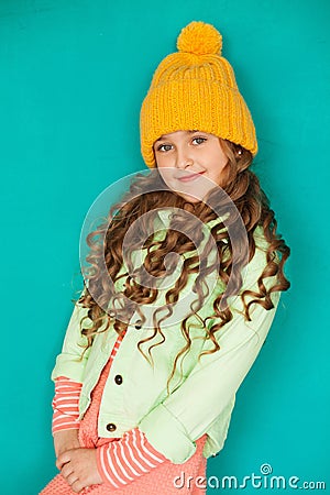 Beautiful little lady in yellow woolen cap Stock Photo