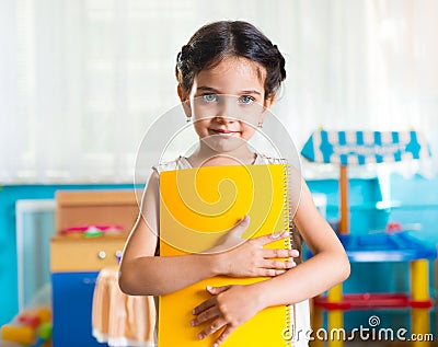 Beautiful little latin girl portrait in daycare Stock Photo