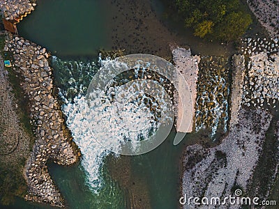 Beautiful Little Waterfall on the Drome River formed from great stones in a mountainous region. A waterfall during the sunset. Stock Photo