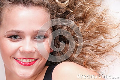 Beautiful long blond curly hair of young attractive woman Stock Photo