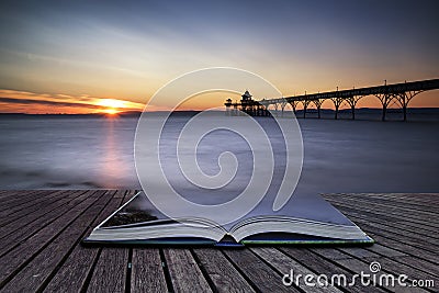 Beautiful long exposure sunset over ocean with pier silhouette c Stock Photo