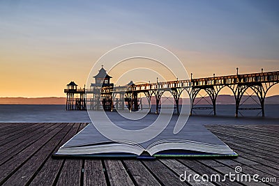 Beautiful long exposure sunset over ocean with pier silhouette c Stock Photo