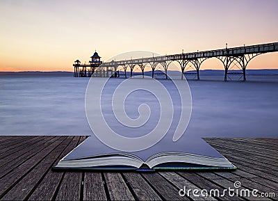 Beautiful long exposure sunset over ocean with pier silhouette c Stock Photo