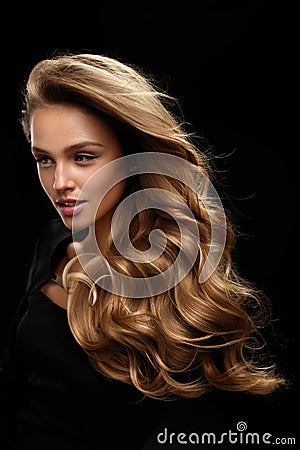 Beautiful Long Hair. Woman Model With Blonde Curly Hair Stock Photo