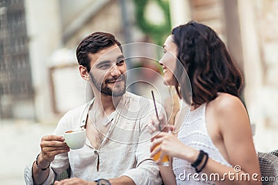 Beautiful loving couple sitting in a cafe enjoying in coffee Stock Photo