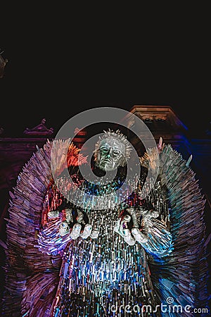 Beautiful low angle view of the knife angel sculpture covered with colorful light Editorial Stock Photo